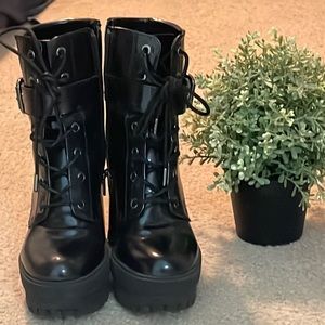 High heeled Black laced boots. size 6 in good condition.